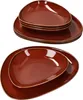 Two stacks of brown, teardrop-shaped plates are shown against a white background. Produktbild-Vorschau