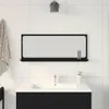 A bathroom vanity with a mirror and shelf above it. Voir les images du produit