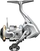 A studio shot of a fishing reel against a white background. Produktbild-Vorschau