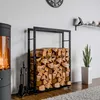 A modern living room with a fireplace, a wood rack filled with firewood, and a snake plant. Podgląd zdjęcia produktu