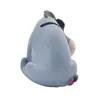 A side view of a gray Eeyore piggy bank sitting down. Produktbild-Vorschau