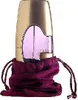 A bottle of Guess Gold eau de Parfum for women is displayed in a purple drawstring pouch against a white background. Podgląd zdjęcia produktu