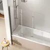 A modern bathroom with a bathtub and a glass shower screen. Anteprima dell’immagine prodotto