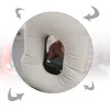 A close-up of a beige inflatable travel pillow with a hand holding a smartphone inside the pillow's opening. Arrows indicate movement or airflow around the pillow. Produktbild-Vorschau