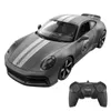 A remote-controlled Porsche 911 Sport Classic car and its controller are shown against a white background. Voir les images du produit