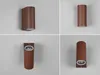 A collage of four images showing different angles and views of a brown outdoor wall light. Voir les images du produit