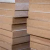 A close-up view of stacked wooden boards. Produktbild-Vorschau