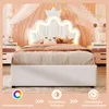 A child's bed with a crown-shaped headboard and LED lighting, set in a bedroom with decorative elements. Produktbild-Vorschau