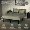 A metal bed frame with bedding in a bedroom setting. Náhľad obrázku produktu