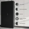A black metal cabinet with several circular insets highlighting its features. Voir les images du produit
