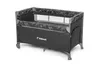A black travel crib with a patterned trim and mesh sides, shown on a white background. Náhled obrázku produktu