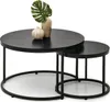 A set of two nesting coffee tables with decorative objects on top. Podgląd zdjęcia produktu