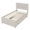 A beige upholstered twin bed frame with a tufted headboard and a slatted mattress support is shown against a white background. The bed frame has three drawers built into the base on one side. Náhled obrázku produktu