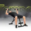 A man is doing chest presses with dumbbells on an adjustable weight bench. The background has a smoky effect and the word 'Tempo' in neon yellow. Náhľad obrázku produktu
