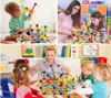 A collage of four images showing children and adults playing with magnetic building blocks in different settings, likely a home and a classroom. Voir les images du produit