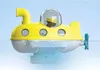 A toy submarine with a figure inside, floating in water. Anteprima dell’immagine prodotto