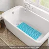 A blue bath mat is placed inside a white bathtub. Produktbild-Vorschau