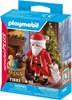 A Playmobil Santa Claus figure with a sack of toys and a Christmas tree in the background, presented on its packaging. Náhľad obrázku produktu