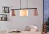 A dining table setting with a pendant light fixture above. Anteprima dell’immagine prodotto
