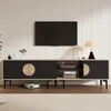 A modern TV stand with a television mounted above it, set in a living room. Anteprima dell’immagine prodotto