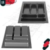 Two views of a gray plastic cutlery organizer for a kitchen drawer, presented against a blueprint-like background. Voir les images du produit