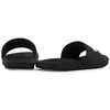 A pair of black Nike Kawa slides shown from a side-angle on a white background. Podgląd zdjęcia produktu