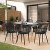 An outdoor patio setting with a dining table and chairs. Voir les images du produit