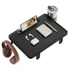 A black bedside table with various accessories on it, against a white background. Náhled obrázku produktu