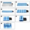 A series of 7 images showing how to fold a picnic blanket. Produktbild-Vorschau