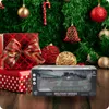 A toy tank is displayed in front of a Christmas tree with gifts. Anteprima dell’immagine prodotto
