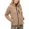 A woman wearing a tan fleece jacket with black trim and a hood, standing against a white background. Produktbild-Vorschau