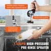 A person is using a commercial pre-rinse sprayer in a kitchen sink to clean a dirty plate. Podgląd zdjęcia produktu