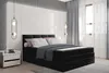 A bedroom scene featuring a black boxspring bed with white and pink pillows and a dark blue duvet. Voir les images du produit