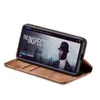 A smartphone in a brown flip case is displayed at an angle, showing a movie playing on its screen. Produktbild-Vorschau
