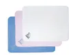 Three fleecy blankets are stacked on top of each other, with the white one on top, then pink, then blue. Produktbild-Vorschau