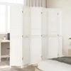 A white room divider is shown in a bedroom setting, with a bed in the foreground and a desk and window in the background. Voir les images du produit