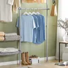 Detailansicht des SoBuy Garderobenständers KLS04-HG: Blaue T-Shirts und Schuhe im Wohnzimmer Produktbild-Vorschau
