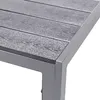 A close-up view of the corner of a table, showing the texture of the tabletop and the metal frame. Produktbild-Vorschau