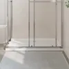 A close-up view of a white rectangular shower tray with a glass shower enclosure. Anteprima dell’immagine prodotto