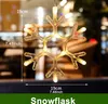 A close-up of a snowflake-shaped LED light hanging in front of a blurred background, with dimensions indicated. Produktbild-Vorschau
