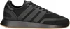 A black Adidas N-5923 sneaker with gray stripes and a brown sole is shown from the side against a white background. Produktbild-Vorschau