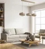 A modern living room with a sofa, coffee table, and pendant lights. Produktbild-Vorschau