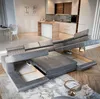 A modern living room and kitchen area with a large sectional sofa. Produktbild-Vorschau