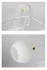Close-up shots of a white ceiling lamp with glass globes. Podgląd zdjęcia produktu