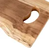 A close-up view of a wooden cutting board with a carved handle. Náhľad obrázku produktu