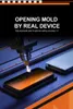 A laser cutting machine is precisely cutting a screen protector for a smartphone. Produktbild-Vorschau