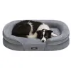 A dog is lying on a dog bed. Produktbild-Vorschau