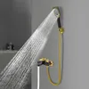 A black and gold shower faucet and hand shower head with water spraying from the shower head. Podgląd zdjęcia produktu