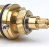 Close-up of a brass shower valve cartridge. Produktbild-Vorschau