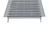 A close-up, straight-on view of a metal drainage grate. Produktbild-Vorschau
